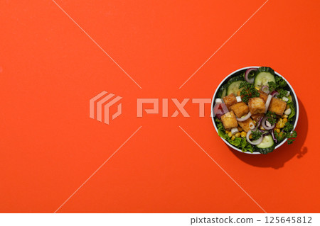 Fried tofu salad in a bowl, top view Fried tofu salad in a bowl, top view 125645812