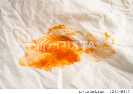 Dirty tomato sauce stain or ketchup on cloth to wash with washing powder, cleaning housework. 125646335