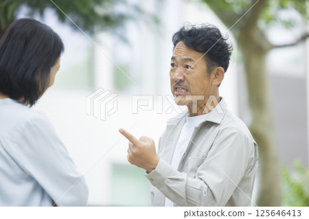Middle-aged couple arguing in the park 125646413