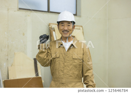 Workers working at a demolition site 125646784