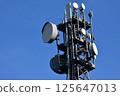 Communication tower and antenna equipment stretching into the blue sky 125647013