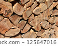 Close-up photo of neatly stacked firewood (natural material) 125647016