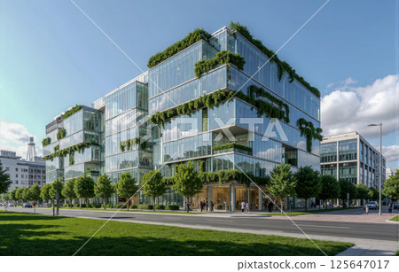 Modern glass office building with green plants on terraces, eco friendly architecture in business district under blue summer sky 125647017
