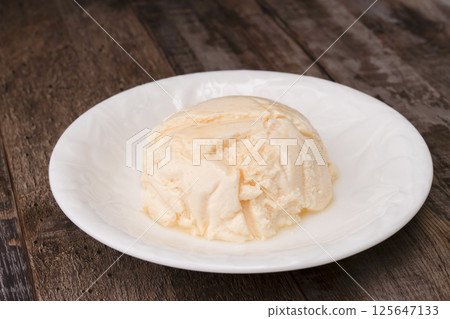 A cake made with high-protein Greek yogurt and finished with blueberry sauce 125647133