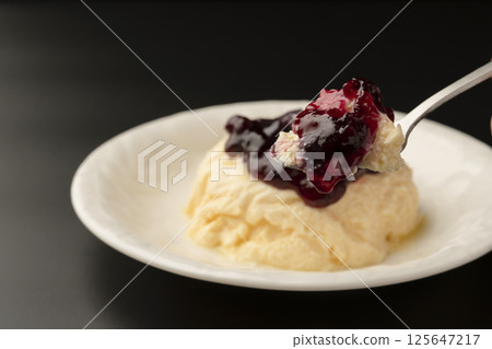 Lifting a cake made with high-protein Greek yogurt with a spoon 125647217