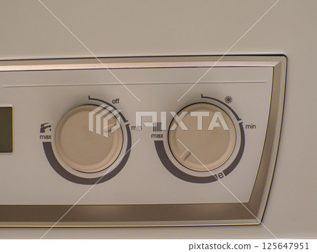 Close-up view of electric boiler water temperature controls with precision dials Close-up view of electric boiler water temperature controls with precision dials 125647951
