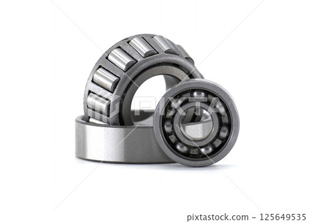 Detailed shot of ball bearings, showcasing their intricate design and mechanical components. Detailed shot of ball bearings, showcasing their intricate design and mechanical components. 125649535