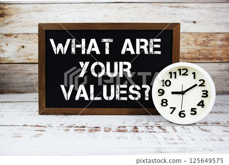 What are your values? text message and alarm clock on wooden background What are your values? text message and alarm clock on wooden background 125649575