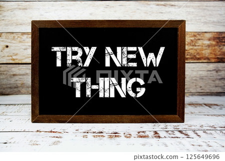 Try New Thing typography text on wooden blackboard Try New Thing typography text on wooden blackboard 125649696