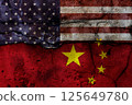 Crack of USA flag and China flag on the concrete wall. The concept of sanctions, trade war, confrontation and severance of agreements. 125649780