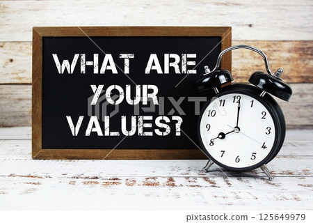 What are Your Values? text message and alarm clock on wooden background What are Your Values? text message and alarm clock on wooden background 125649979