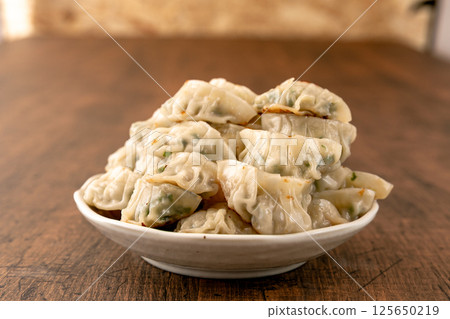 A mountain of bite-sized fried dumplings A mountain of bite-sized fried dumplings 125650219