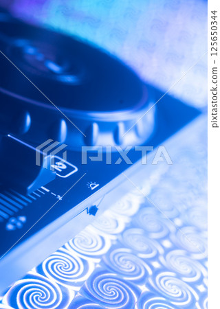 Dj turntables in nightclub Dj turntables in nightclub 125650344