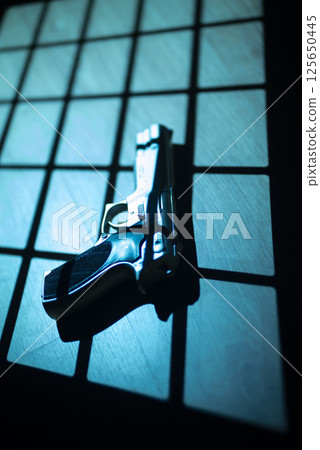 Pistol gun crime thriller 125650445