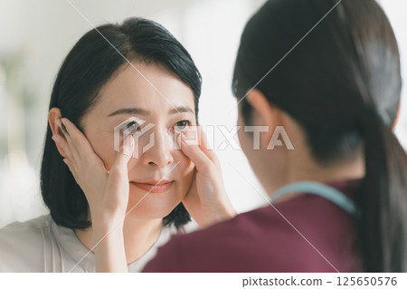 Female patient in her 50s Female patient in her 50s 125650576