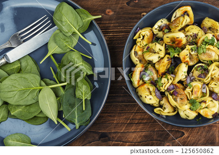 Vegan spinach ravioli or dumplings. 125650862