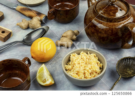 Fresh ginger lemon tea, healthy beverage. 125650866