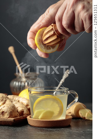 Ginger tea with lemon and honey. 125651311