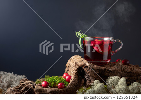 Hot drink with cranberries, lime, and rosemary. 125651324