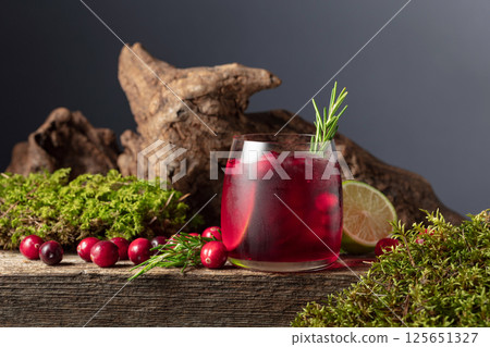 Refreshing cranberry hard seltzer with lime, rosemary, and ice. 125651327