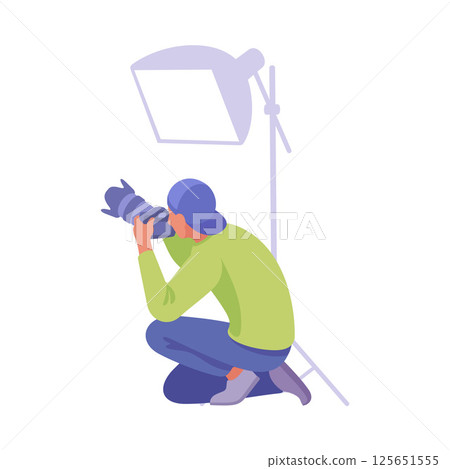 A Professional Photographer Specializing in Capturing Stunning Shots in a Studio Environment 125651555