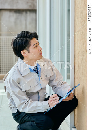 A young man in his 20s checking 125652651