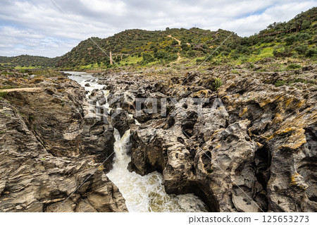 The Leap of the wolf, Pulo do Lobo waterfall in the Guadiana Valley Natural Park at Mertola, Portugal The Leap of the wolf, Pulo do Lobo waterfall in the Guadiana Valley Natural Park at Mertola, Portugal 125653273