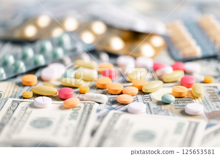 Medical business, a doctor carefully manages the money for each dose of medication, ensuring that even narcotic prescriptions are given against a backdrop of responsible health care. medicine, money. Medical business, a doctor carefully manages the money for each dose of medication, ensuring that even narcotic prescriptions are given against a backdrop of responsible health care. medicine, money. 125653581
