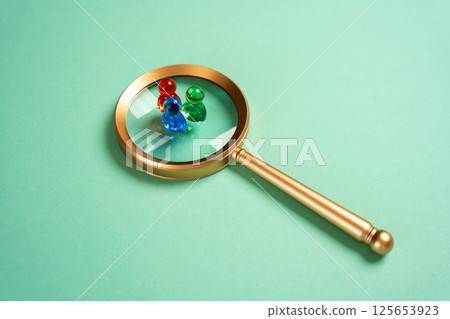 Figures of people and a magnifying glass. Search for recruitment. Social research. Human resources, demographic studies, and talent scouting shape organizational and research success. 125653923