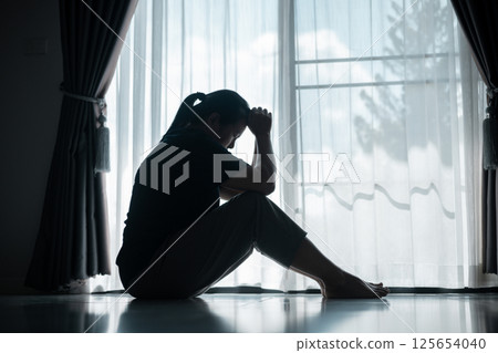 young woman sat alone, feeling weight of anxiety, stress, and depression, her sadness echoing struggles many people face in silence. anxiety, stress, depression, woman, person, sad, adult, alone. 125654040
