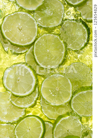 Green Lime Slices. Water Ripple Effect 125654829