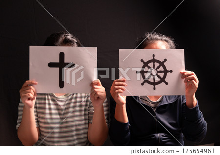 Through dialogue, mutual respect, person of faith extends their hand, promoting oneness, harmony, tolerance among diverse religious beliefs. religion, faith, person, dialogue, hand, oneness, harmony. 125654961