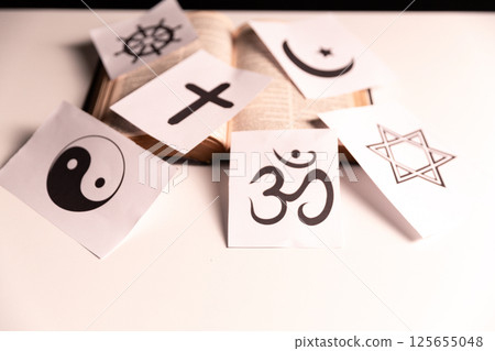 Concept of interfaith dialogue promotes understanding and spirituality by bringing together symbols, beliefs from diverse religions Hinduism, Islam, Judaism, Buddhism, faith and religious harmony. 125655048