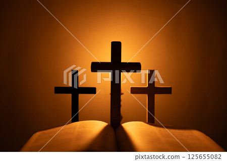 Light candle with holy bible and cross or crucifix on old wooden background in church.Candlelight and open book on vintage wood table christianity study and reading in home.Concept of christ religion Light candle with holy bible and cross or crucifix on old wooden background in church.Candlelight and open book on vintage wood table christianity study and reading in home.Concept of christ religion 125655082