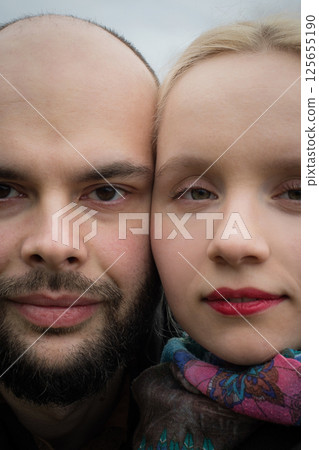 Close-up face of couple. Man and woman in love, outdoors lifestyle portrait 125655190