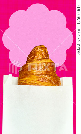 Fresh golden croissant peeking from white paper bag on bold red background with pink cloud graphic. 125655612