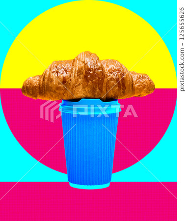 Golden croissant placed on blue takeaway coffee cup with bold pop art background of turquoise, yellow and magenta. 125655626