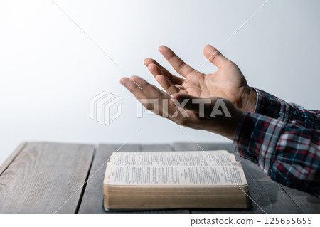 Christian life crisis prayer to god. Woman Pray for god blessing to wishing have a better life. woman hands praying to god with the bible. begging for forgiveness and believe in goodness. 125655655