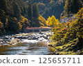 Taigetsu bridge across Tomoe river at Korankei gorge during autumn season 125655711
