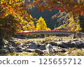 Taigetsu bridge across Tomoe river at Korankei gorge during autumn season 125655712