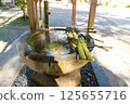 Traditional Japanese ritual washing hands sink station with bamboo ladle 125655716