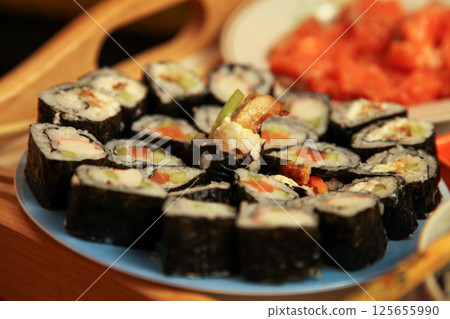 table with a set of rolls and sauce 125655990