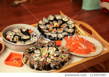 table with a set of rolls and sauce table with a set of rolls and sauce 125655997