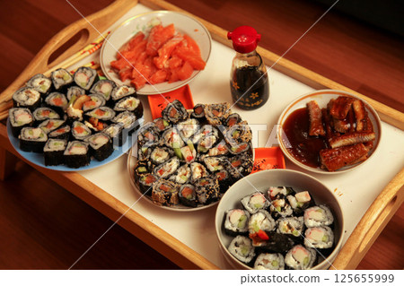 table with a set of rolls and sauce 125655999