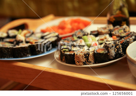 table with a set of rolls and sauce 125656001