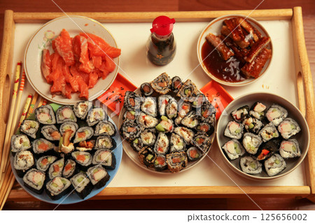 table with a set of rolls and sauce table with a set of rolls and sauce 125656002