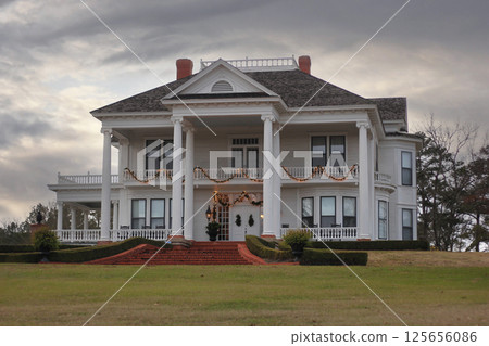 Historic Antebellum Home With Christmas Decorations at Sunset in Rural TX Historic Antebellum Home With Christmas Decorations at Sunset in Rural TX 125656086
