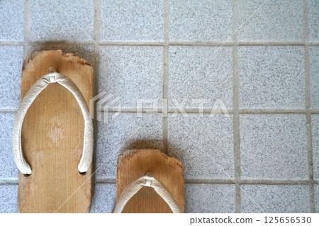 Worn-in wooden clogs 125656530