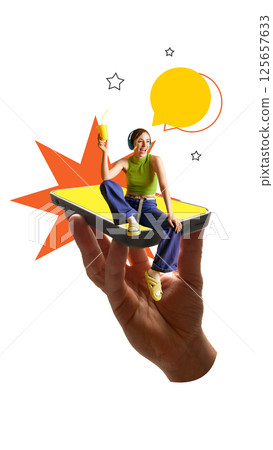 Joyful woman sitting on smartphone with drink and headphones smiles as stars and speech bubbles float. 125657633