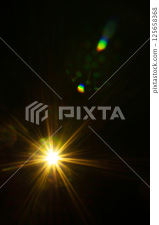 Sun flare on the black background Sun flare on the black background 125658368